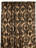 A window curtain featuring a beige taffeta fabric with a black velvet flocked damask pattern.